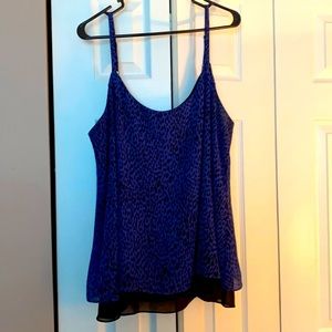 Torrid, size 2 top. Flows with a cute cut pattern in the back.